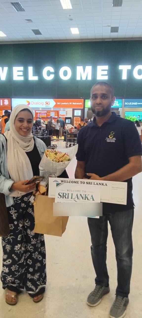 A Serendib staff member welcoming a guest at the airport