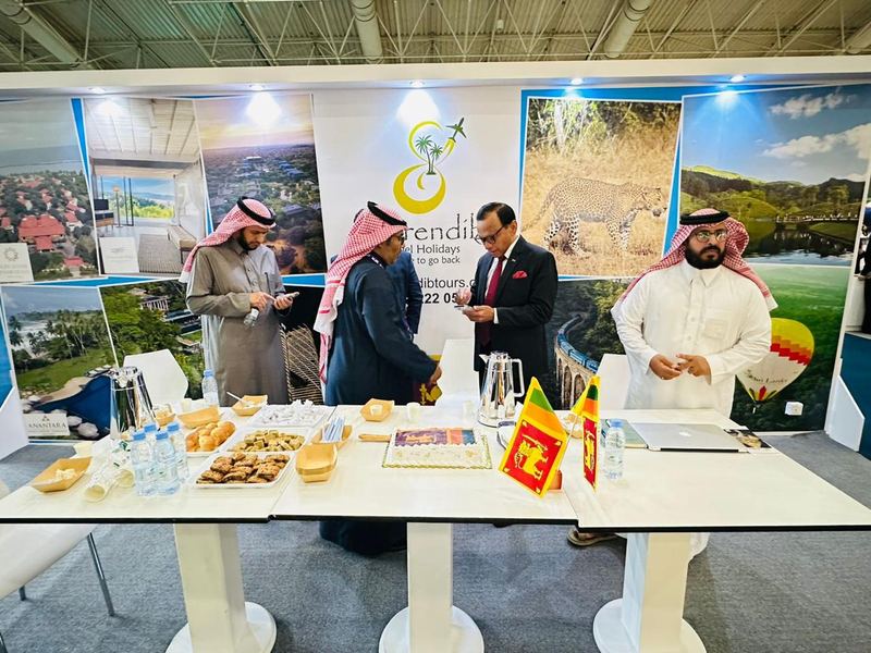 Visitors at the Serendib Travel Holidays stand at a travel trade show